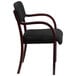 A Flash Furniture black fabric side chair with mahogany wood legs and frame.