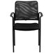 A Flash Furniture black steel side chair with a mesh back.