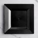 A Visions Florence black square plastic plate on a white surface.