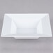 A white square Visions Florence plastic bowl.