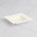 A white square Visions Florence plastic bowl on a white surface.