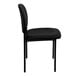 A Flash Furniture black vinyl stackable side chair with a black frame.