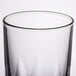 An Arcoroc highball glass with a black rim.