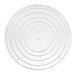 A white circular Wilton cake separator plate with a scalloped edge.
