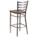 A Clear-Coated metal restaurant barstool with a mahogany wood seat.