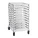 A metal sheet pan rack with ten shelves, covered by a clear plastic cover and equipped with four caster wheels.