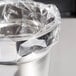 A close-up of a plastic wrap around a silver container.