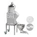A Robot Coupe CL55 food processor with 2 feed heads and discs over a bowl.