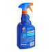 A blue bottle of Spot Shot Professional Strength carpet stain remover with an orange label.