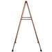 A wooden A-frame sign board with a white marker board.