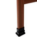 The cherry wood A-frame of an Aarco A-frame sign board with white marker board on a table.