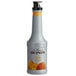 A white bottle of Monin Mango Fruit Puree with a close up of a mango on the label.