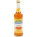 A 750 mL bottle of Monin Sugar Free Caramel Flavoring Syrup.