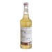 A 750 mL bottle of Monin Premium Lime Flavoring Fruit Syrup.