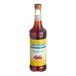 A Monin Sugar-Free Raspberry Fruit Syrup bottle with a yellow label.