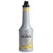 A white Monin bottle of Banana Fruit Puree.