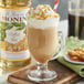 A glass of Monin toffee nut flavored coffee.