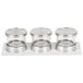 A white wooden tray with three Cal-Mil glass containers and stainless steel lids.