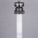A white plastic Monin bottle with a black pump.