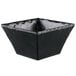 A black square melamine bowl with a metal rim.