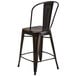 A black metal restaurant bar stool with a backrest.