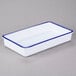 A white rectangular melamine tray with blue trim.