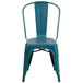 A blue metal chair with a slatted seat and back.