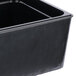 A black rectangular Cal-Mil faux slate ice housing on a counter.
