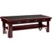 A mahogany Vollrath induction buffet table with wheels and buttons.