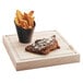 A piece of steak and french fries in a Cal-Mil faux slate french fry holder.