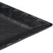 A black faux slate Cal-Mil platter with a raised rim.
