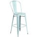 A blue metal bar stool with a vertical slat back.