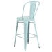 A blue metal restaurant bar stool with a vertical slat back.