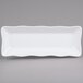 A white rectangular melamine tray with a scalloped edge.