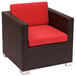 A BFM Seating wicker armchair with red cushion.
