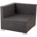 A brown wicker BFM Seating Aruba armchair with a metal frame.