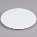 An Elite Global Solutions white melamine plate on a gray surface.