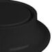 A black round pedestal with a white background.