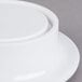 A round white melamine pedestal with a round white surface.