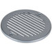 A round metal drain cover with holes.