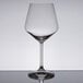 A clear Spiegelau Burgundy wine glass on a reflective surface.