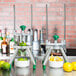 A Garde WEDGE6 fruit and vegetable wedge cutter on a white counter with lemons and limes in bowls.