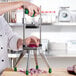 A person using a Garde vegetable dicer to chop onions.