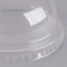 A clear plastic dome lid with a hole on top over a white background.