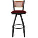 A BFM Seating bar stool with a red swivel seat and black metal frame.