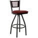 A BFM Seating black metal bar stool with mahogany wood back and burgundy vinyl swivel seat.