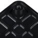 A black plastic Garde push block with holes.