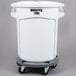 A white Rubbermaid BRUTE trash can with wheels.