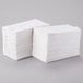 A stack of white napkins.