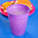 A purple plastic cup with ice in it.